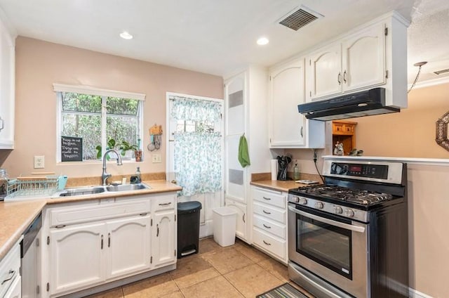 kitchen featuring stainless steel appliances, visible vents, white cabinetry, a sink, and under cabinet range hood