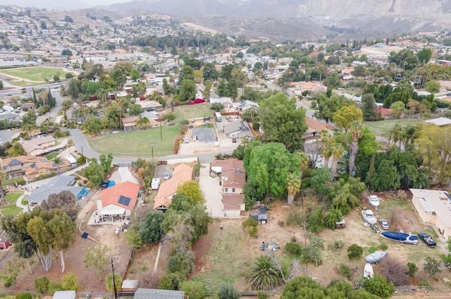 birds eye view of property with a residential view and a mountain view