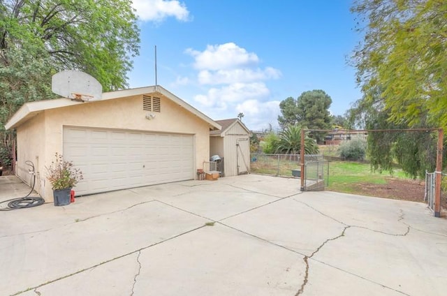 garage featuring fence