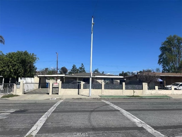 view of front of house featuring a fenced front yard and a gate