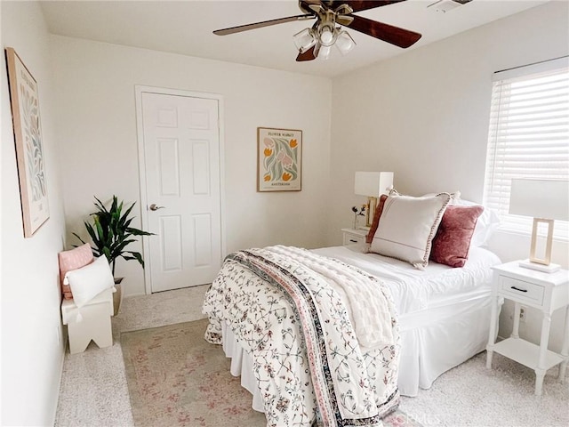 carpeted bedroom featuring ceiling fan