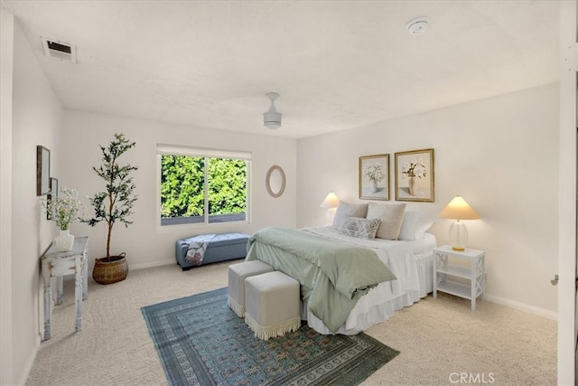 bedroom featuring visible vents, carpet, and baseboards