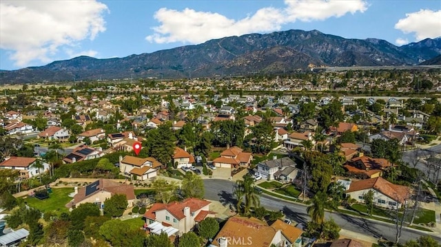 birds eye view of property with a residential view and a mountain view