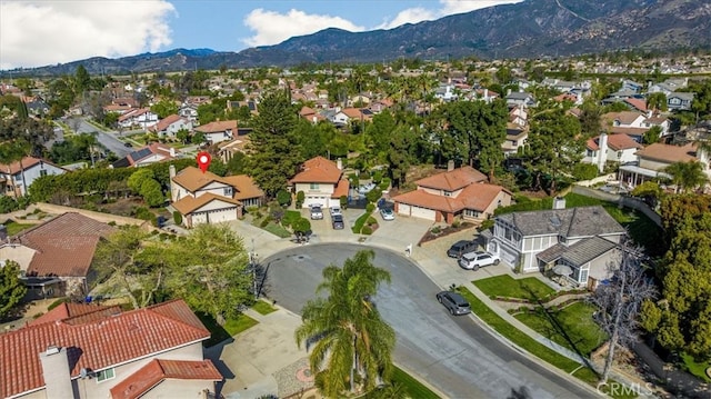 drone / aerial view featuring a residential view and a mountain view