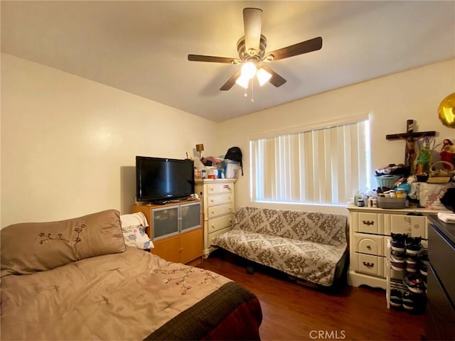 bedroom featuring dark wood finished floors and a ceiling fan