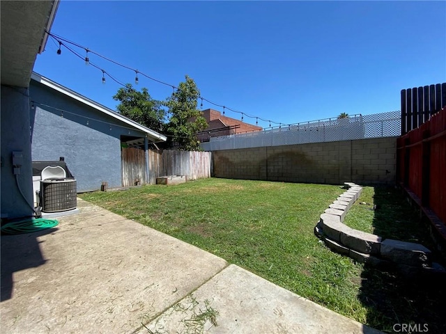 view of yard featuring cooling unit, a patio area, and a fenced backyard