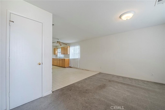 unfurnished living room with visible vents