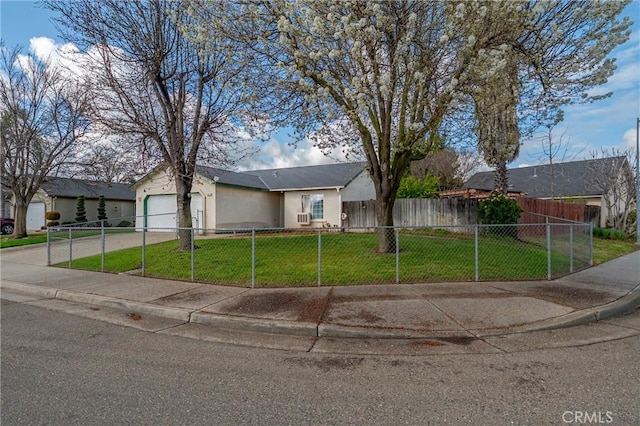 ranch-style house featuring a front lawn, a fenced front yard, stucco siding, a garage, and driveway