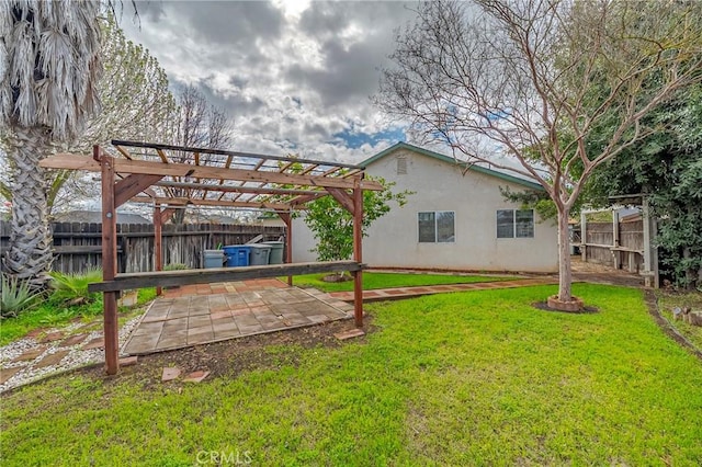 view of yard featuring a patio area, a fenced backyard, and a pergola