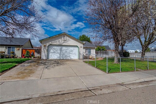 single story home featuring a fenced front yard, stucco siding, a garage, driveway, and a front lawn