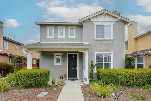 view of front of house featuring stucco siding