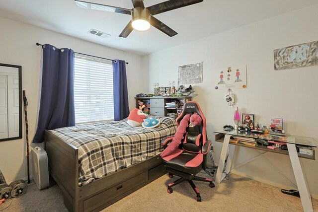 bedroom featuring visible vents, baseboards, a ceiling fan, and carpet