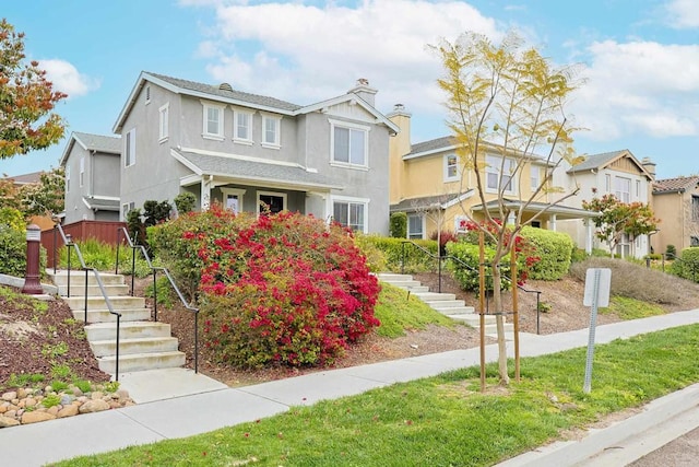 1582 Moonbeam Ln, Chula Vista, CA 91915 - view of front facade featuring stairs, stucco siding, a residential view, and a chimney