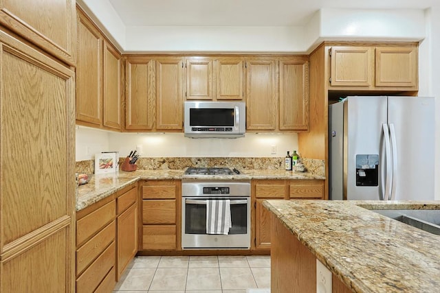 1582 Moonbeam Ln, Chula Vista, CA 91915 - kitchen featuring appliances with stainless steel finishes, light tile patterned flooring, and light stone counters