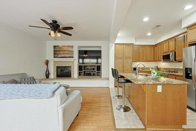 1582 Moonbeam Ln, Chula Vista, CA 91915 - kitchen with stainless steel appliances, open floor plan, ceiling fan, a sink, and recessed lighting