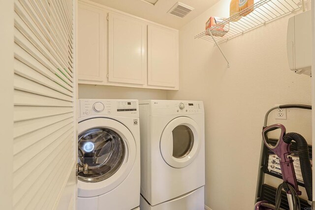 1582 Moonbeam Ln, Chula Vista, CA 91915 - laundry room featuring independent washer and dryer and cabinet space