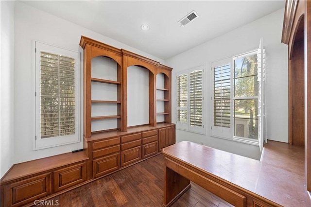 unfurnished office featuring dark wood-style floors and visible vents