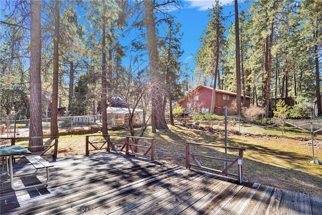 deck with fence and a lawn