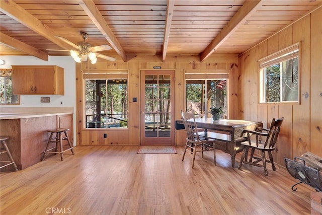 dining area with plenty of natural light and light wood-style flooring