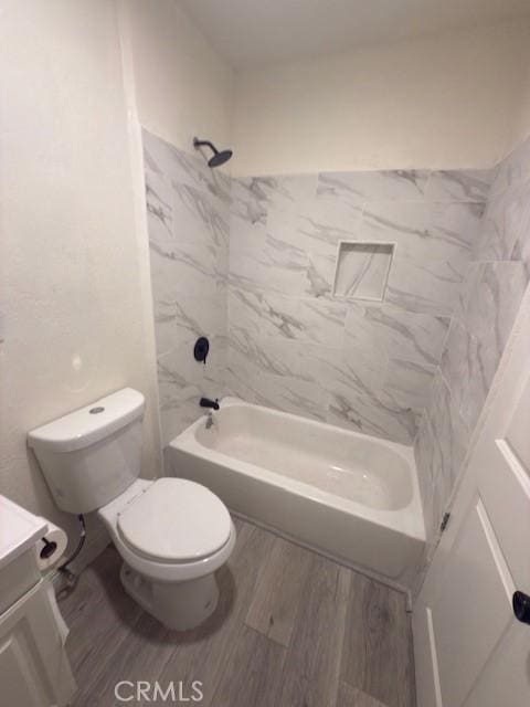 full bath with vanity, bathtub / shower combination, wood finished floors, and toilet