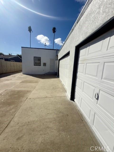 garage featuring fence