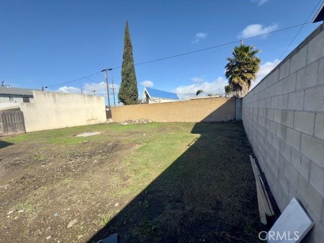 view of yard with a fenced backyard