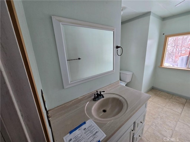 bathroom featuring vanity and baseboards