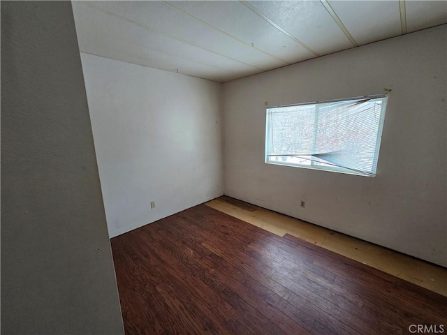 empty room with wood finished floors