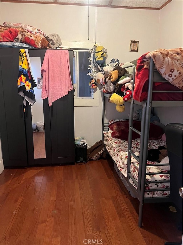 bedroom featuring wood finished floors