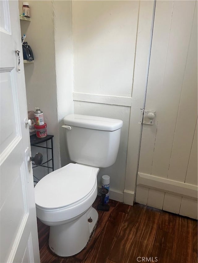 bathroom featuring toilet and wood finished floors