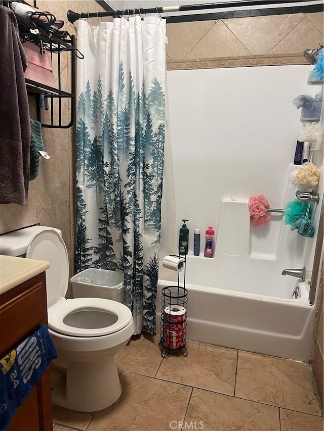 bathroom with shower / bath combo and toilet