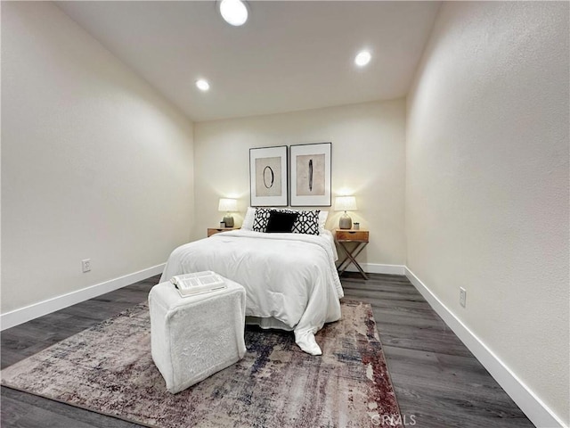 bedroom with dark wood-style floors, baseboards, and recessed lighting