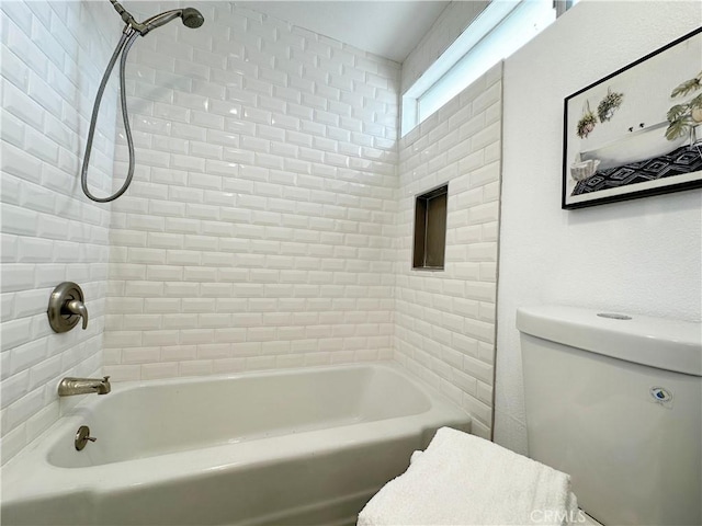 bathroom featuring toilet and shower / tub combination