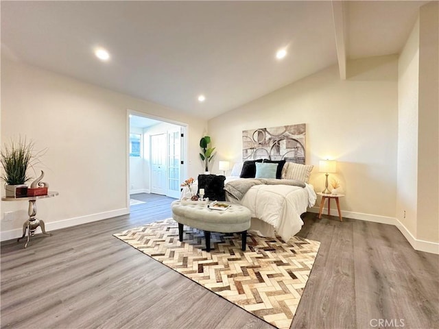 bedroom featuring lofted ceiling with beams, recessed lighting, wood finished floors, and baseboards