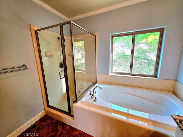 bathroom with ornamental molding, a stall shower, a jetted tub, and baseboards