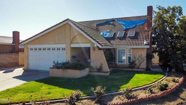 view of front of house featuring an attached garage, a front yard, concrete driveway, and stucco siding