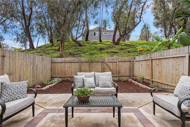 view of patio / terrace with outdoor lounge area and a fenced backyard