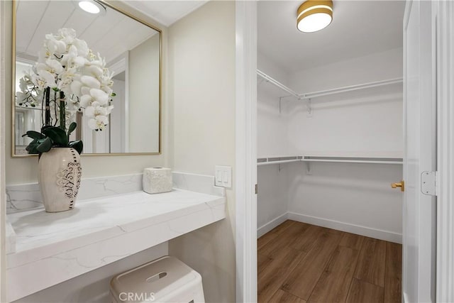 spacious closet featuring wood finished floors