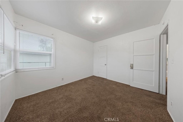 spare room featuring carpet floors