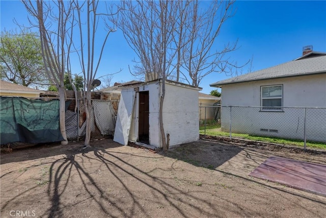 view of shed with a fenced backyard