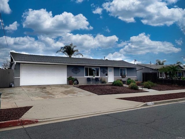 single story home featuring a garage, driveway, and fence