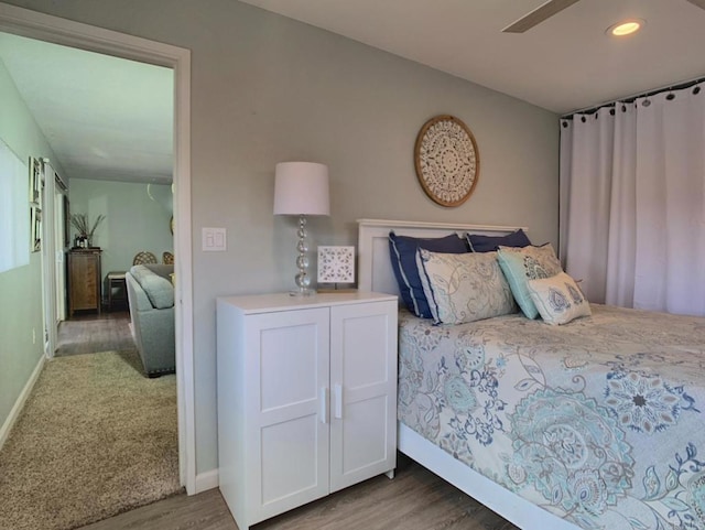 bedroom featuring recessed lighting, baseboards, and wood finished floors