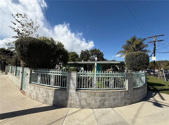 view of home's community with fence