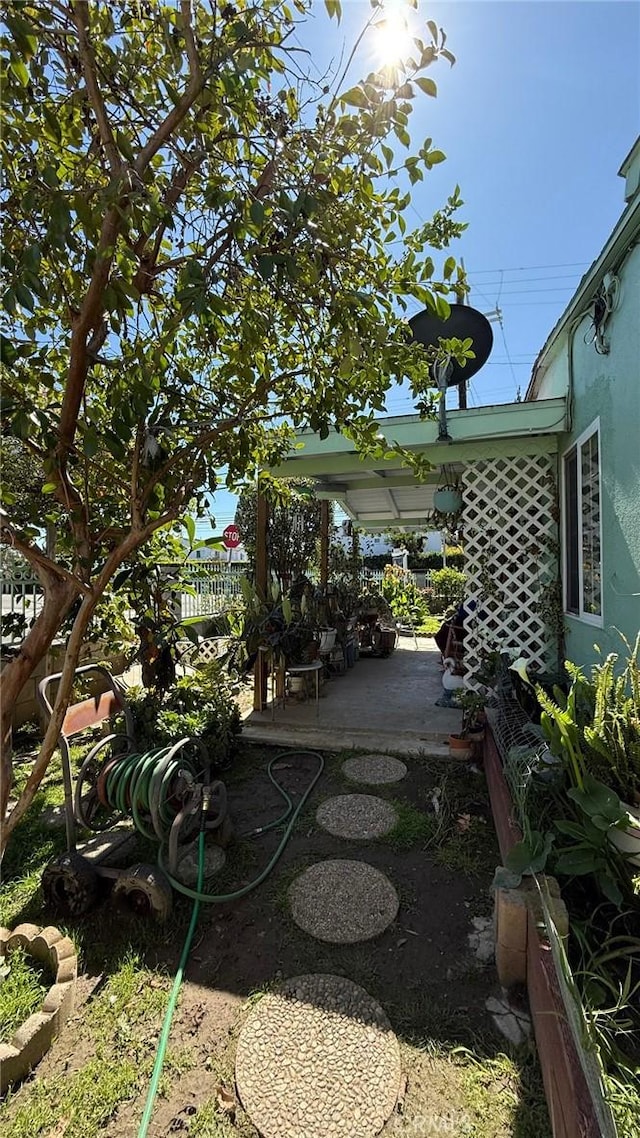 view of yard featuring a patio area and fence