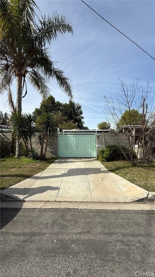 view of gate featuring fence