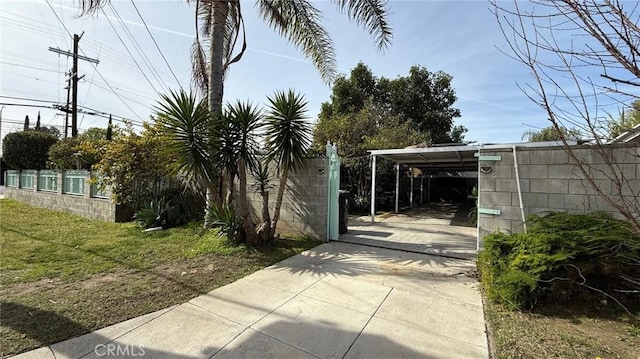 exterior space featuring a carport and driveway