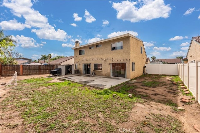 back of property featuring a patio area, a fenced backyard, and stucco siding