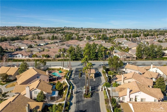 birds eye view of property with a residential view