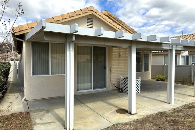 exterior space with fence and a pergola