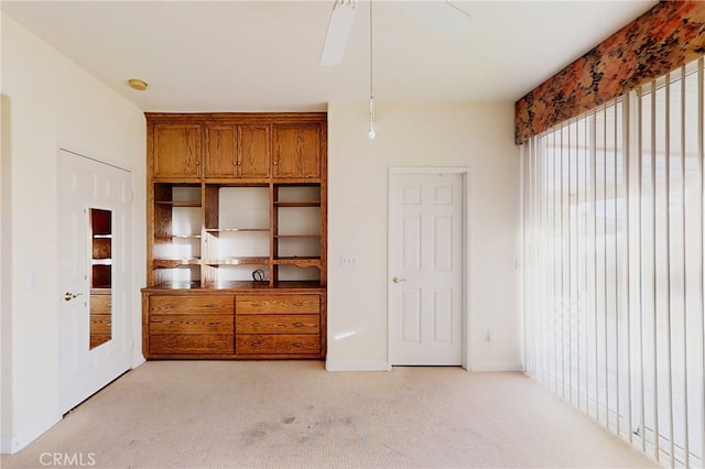 unfurnished bedroom with light colored carpet